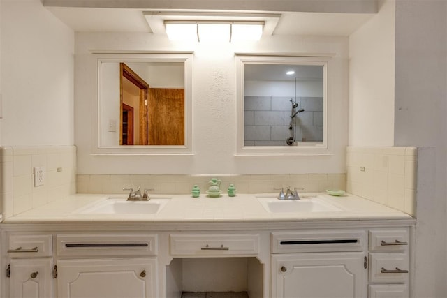 full bathroom with double vanity, a sink, and decorative backsplash