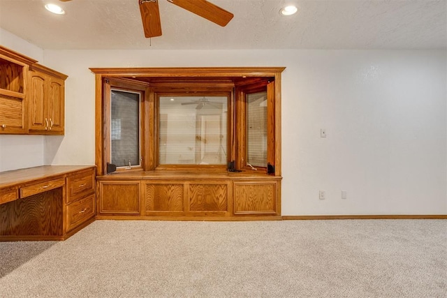 interior space with recessed lighting, light colored carpet, and a textured ceiling