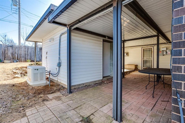 view of patio featuring fence