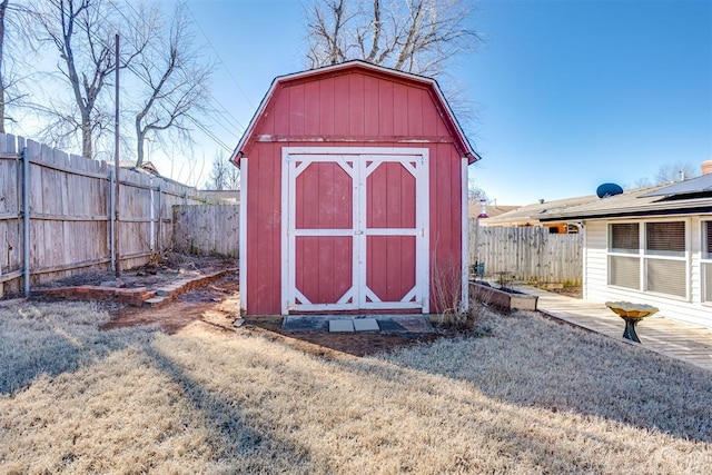 view of shed with a fenced backyard