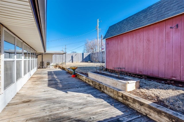 exterior space with an outbuilding and fence