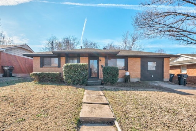 ranch-style house featuring brick siding and a front yard