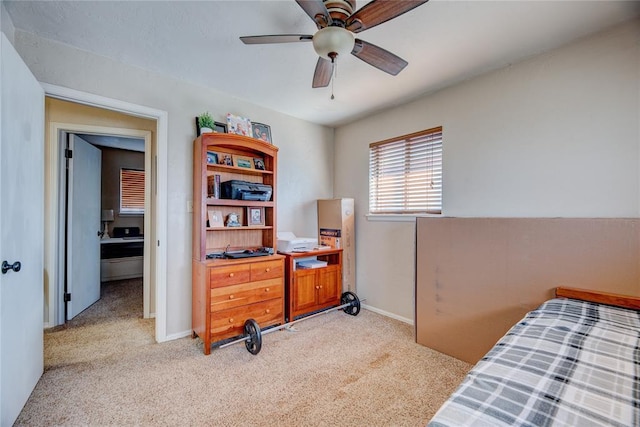 bedroom featuring light carpet, ceiling fan, and baseboards