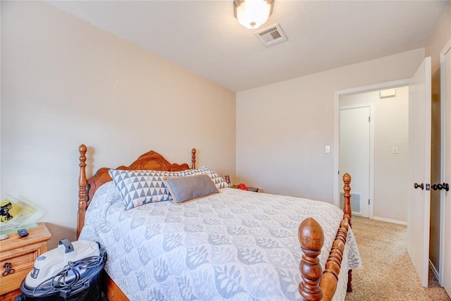 bedroom with baseboards, visible vents, and carpet flooring