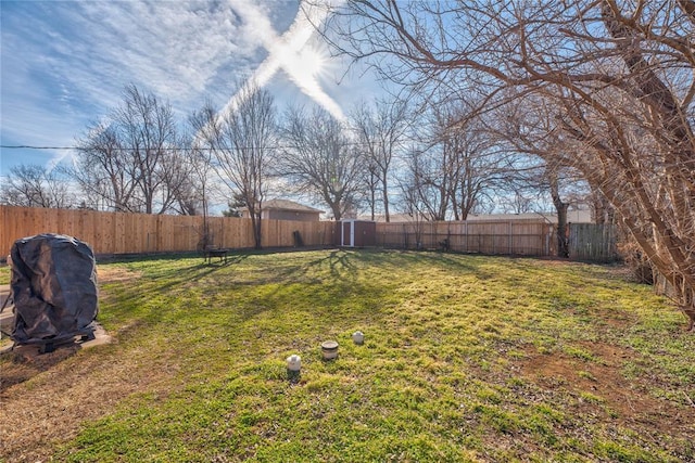 view of yard with a fenced backyard