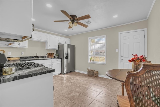 kitchen featuring white cabinets, dark countertops, ceiling fan, ornamental molding, and stainless steel refrigerator with ice dispenser