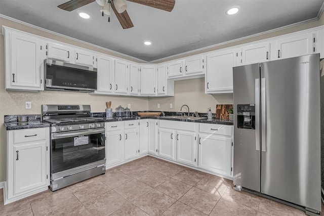 kitchen with white cabinets, stainless steel appliances, and a sink