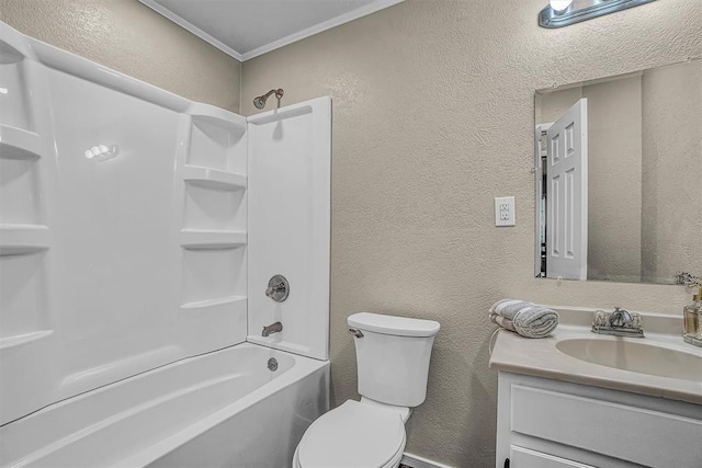 bathroom with a textured wall, bathtub / shower combination, toilet, vanity, and ornamental molding