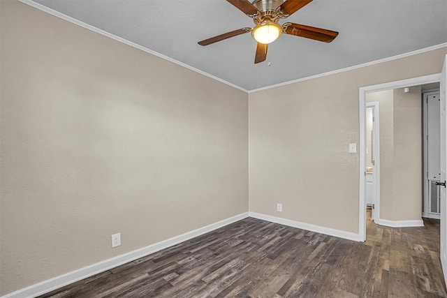 empty room with dark wood-style floors, a ceiling fan, baseboards, and crown molding