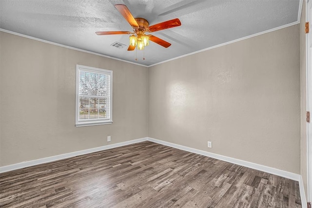 unfurnished room with a textured ceiling, dark wood-type flooring, a ceiling fan, visible vents, and crown molding