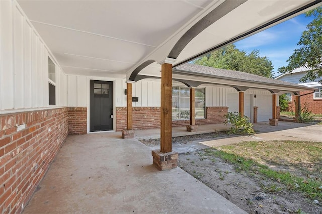 view of patio featuring a garage