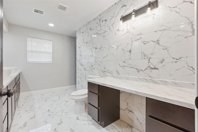 bathroom featuring toilet, recessed lighting, vanity, visible vents, and marble finish floor