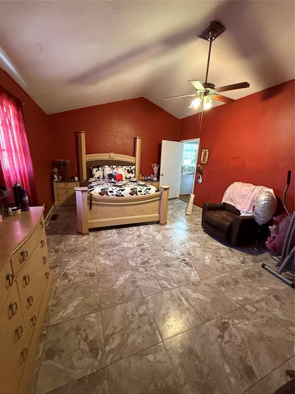 505 SE 18th St, Oklahoma City, OK 73129 - bedroom with lofted ceiling and a ceiling fan