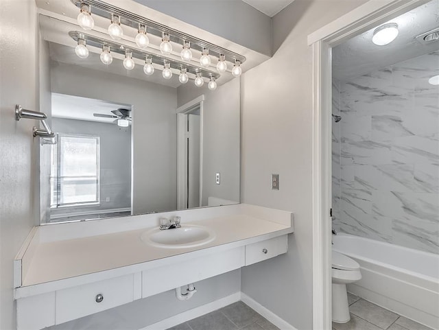 bathroom featuring toilet, ceiling fan, tile patterned floors, vanity, and shower / bathing tub combination