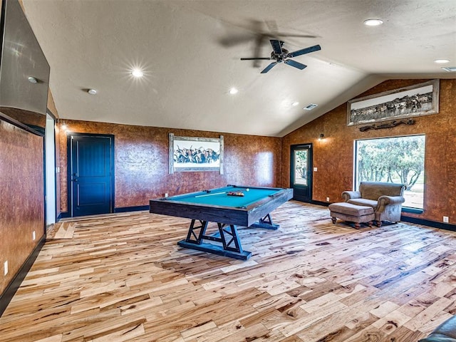 rec room with lofted ceiling, visible vents, pool table, light wood-style flooring, and ceiling fan