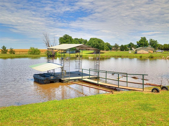 dock area featuring a water view and a yard