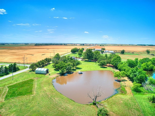 drone / aerial view with a rural view and a water view