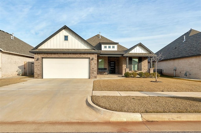 view of front of house with central air condition unit, covered porch, brick siding, concrete driveway, and board and batten siding