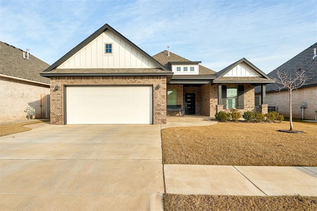 view of front of property with concrete driveway, brick siding, board and batten siding, and an attached garage