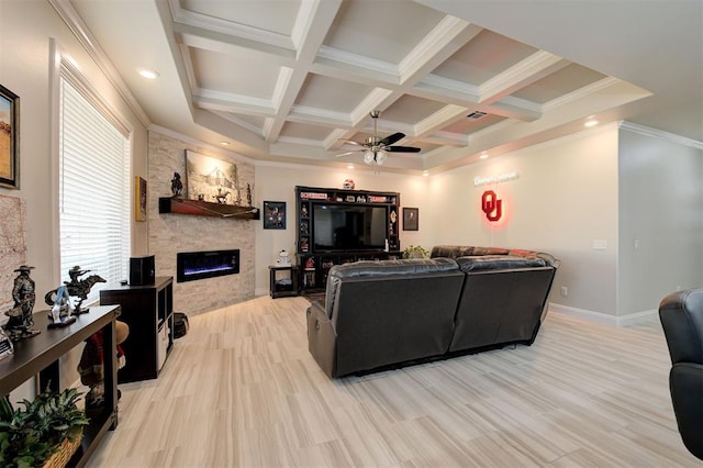 living room with a stone fireplace, coffered ceiling, a ceiling fan, light wood-style floors, and beamed ceiling