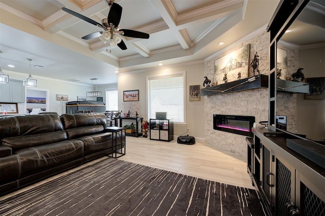 living area featuring crown molding, a stone fireplace, wood finished floors, coffered ceiling, and beamed ceiling