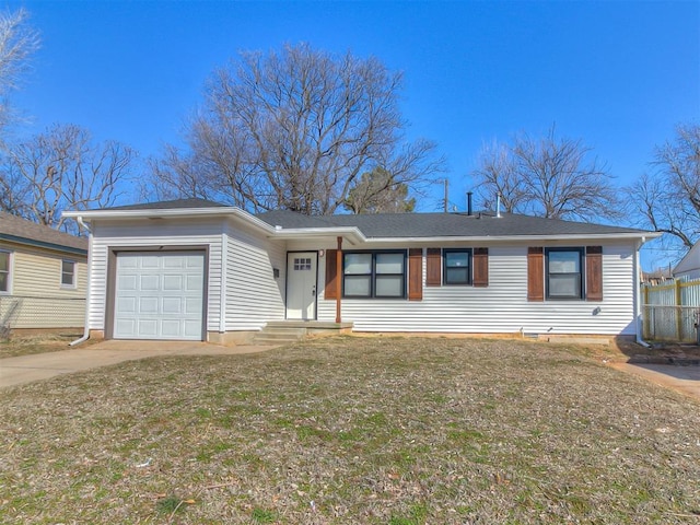 single story home featuring concrete driveway, a front lawn, and an attached garage