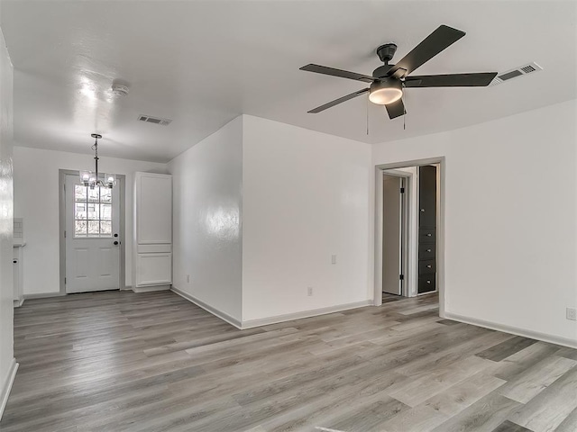 entryway featuring light wood-type flooring, visible vents, and baseboards