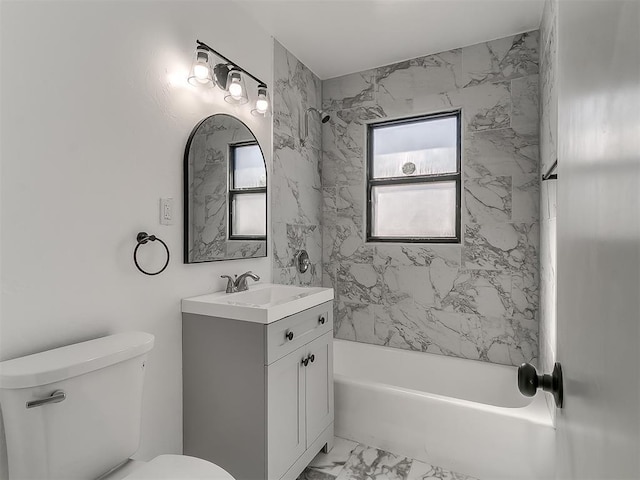 full bath featuring marble finish floor, tub / shower combination, vanity, and toilet