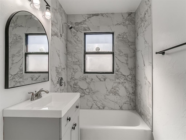 bathroom featuring shower / bath combination and vanity