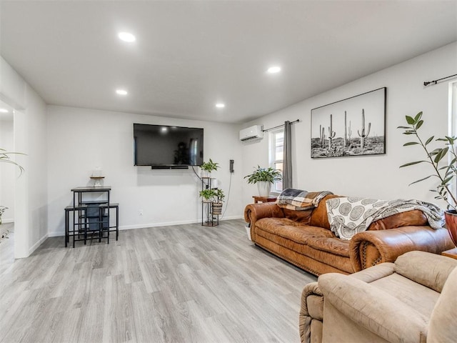 living room featuring recessed lighting, a wall mounted air conditioner, baseboards, and wood finished floors