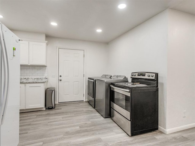 laundry room featuring laundry area, baseboards, light wood finished floors, and recessed lighting