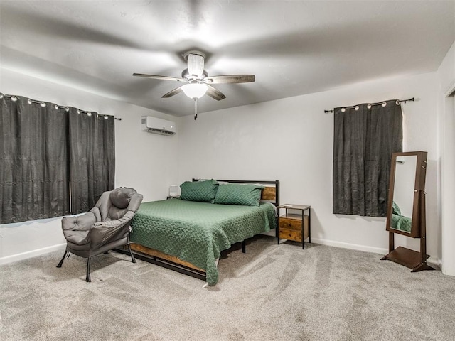 bedroom featuring carpet floors, ceiling fan, baseboards, and a wall mounted air conditioner