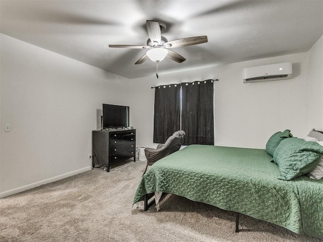 bedroom with a ceiling fan, baseboards, carpet flooring, and a wall mounted air conditioner