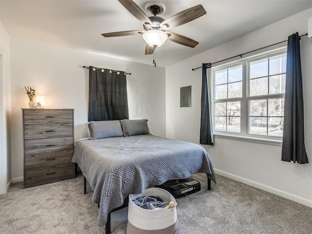 bedroom with electric panel, baseboards, a ceiling fan, and light colored carpet
