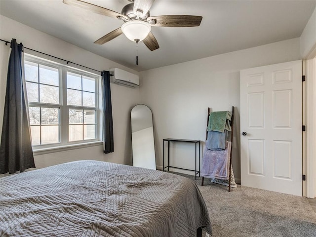 bedroom with ceiling fan, an AC wall unit, and carpet flooring