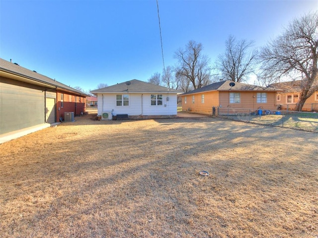 back of property featuring fence and central air condition unit