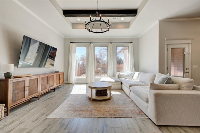 living room featuring light wood-style flooring, crown molding, a chandelier, and beamed ceiling