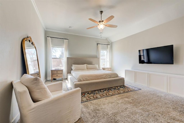 carpeted bedroom with ceiling fan, multiple windows, visible vents, and crown molding