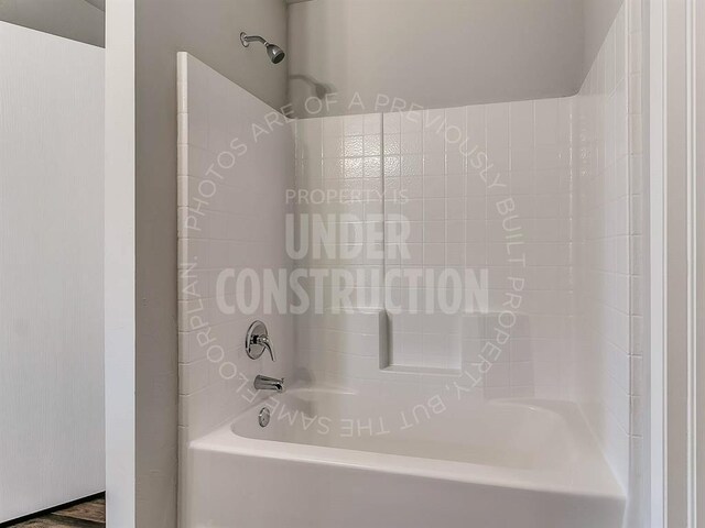 full bathroom with shower / washtub combination