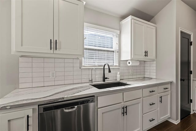 kitchen with a sink, white cabinetry, stainless steel dishwasher, backsplash, and light stone countertops