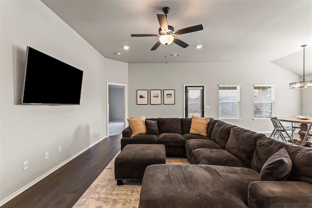 living room with dark wood finished floors, recessed lighting, visible vents, baseboards, and ceiling fan with notable chandelier