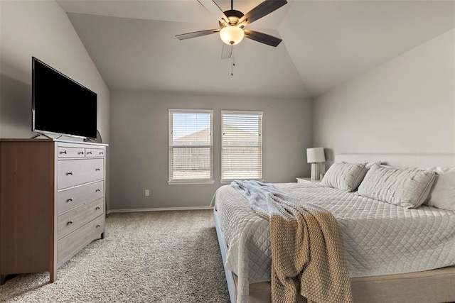 bedroom with lofted ceiling, ceiling fan, baseboards, and light colored carpet