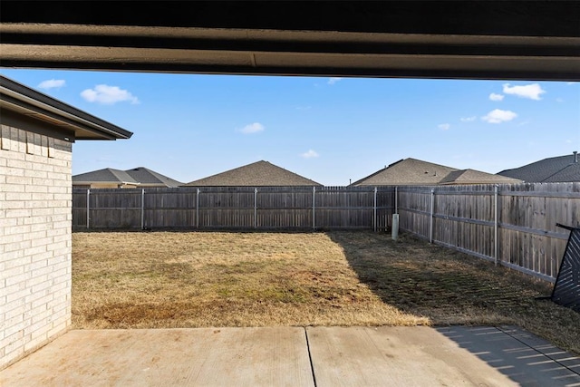 view of yard with a patio area and a fenced backyard