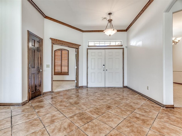 entrance foyer featuring visible vents, crown molding, baseboards, and light tile patterned floors