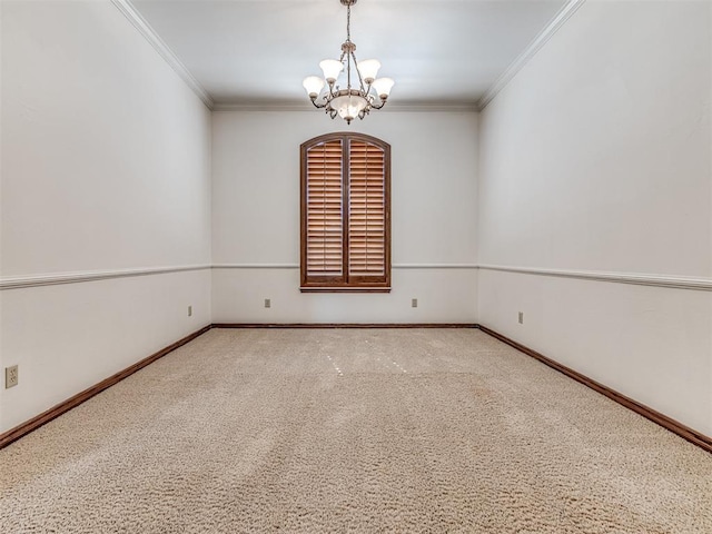 carpeted empty room with a notable chandelier, crown molding, and baseboards