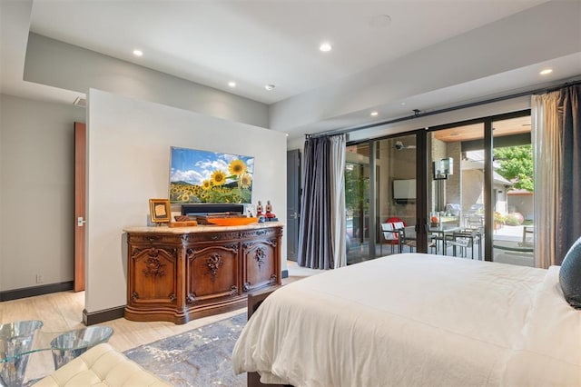 bedroom featuring access to exterior, light wood-style flooring, baseboards, and recessed lighting