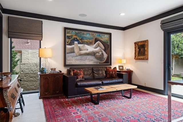 sitting room featuring recessed lighting, crown molding, and baseboards