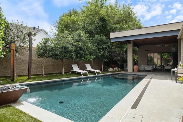 view of swimming pool with ceiling fan, a patio, a fenced backyard, and a fenced in pool