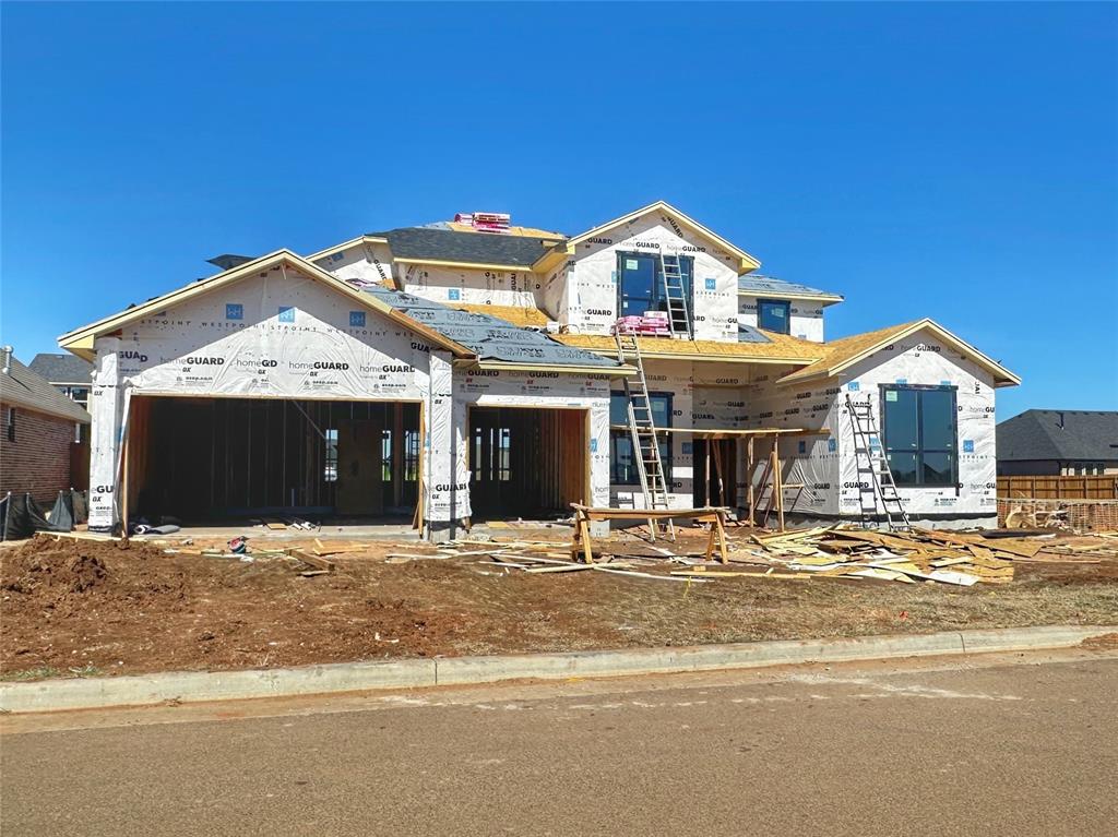 property in mid-construction featuring a garage