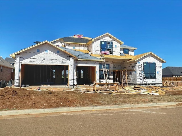 property in mid-construction featuring a garage